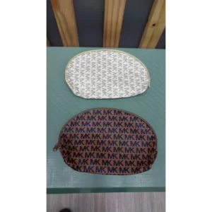 Two Makeup Bags on a table.