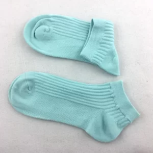 Two pairs of Unisex Soaked Short Socks on a white surface.