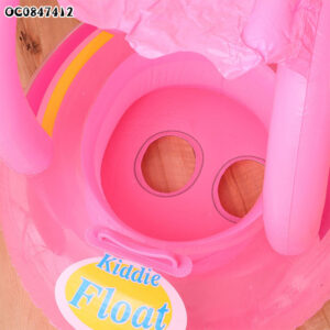 A pink inflatable float with a hole in the middle.