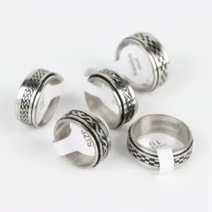 A set of Classic Stainless Steel Rings with designs on them.