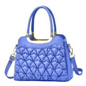 A blue quilted handbag with gold hardware.