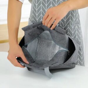 A person is holding an Aluminum Foil Large Capacity Insulation Lunch Bag.