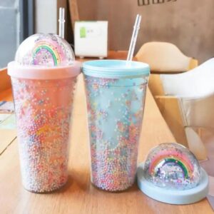 Two 3D Rainbow Glitter Stars Tumblers with rainbow sprinkles and a straw.