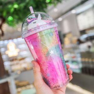 A person holding up a 500Ml Colorful Cartoon Unicorn Plastic Straw Cup.