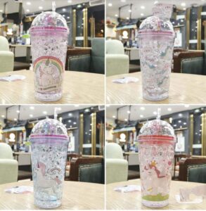 A set of four 3D Rainbow Glitter Stars Tumblers with unicorns on them.