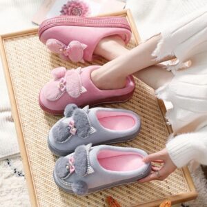 A woman wearing a pair of Women's Winter Thickened Anti Slip Slippers.