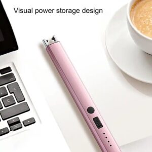 A pink AmpedTrends Arc Lighter with a cup of coffee next to a laptop.
