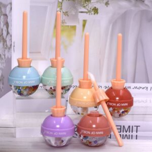 A set of Lip Gloss Long Lasting Lips in different colors on a table.