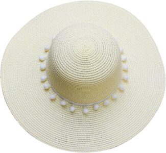 A Panama Elegant sun hat with pom poms on it.
