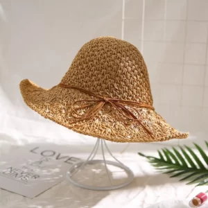 A fashionable Women's Hat resting on a table with a wide brim.