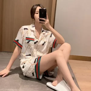 A woman is taking a selfie in a Silk Short-Sleeved Shorts Pajamas Set.