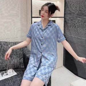 A woman wearing a Silky Check Plaid Pyjama Set.