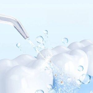 A tooth is being sprayed with a Water Flosser Usb Rechargeable Dental Whitening and bubbles.