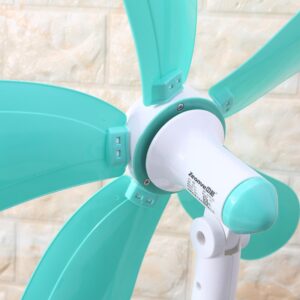 A Mini Clip Electrical Table Fan is mounted on a brick wall.