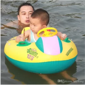 A man and a baby in a Baby Swimming Pool Boat With Canopy at a swimming pool.