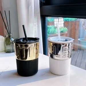 An Electroplating Coffee Cup With Lid Straw and an Electroplating Coffee Cup With Lid Straw.