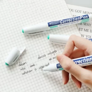 A person using a Uni Correction Pen on paper.