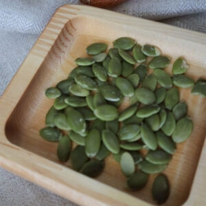 Rectangular bamboo wooden tray in a wooden tray on a table.