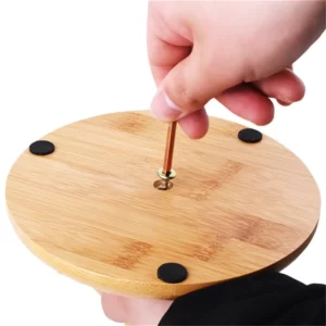 A person is holding a Bamboo Wooden Six Cup Holder Rack on a wooden base.