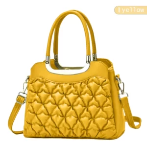 A yellow handbag with a quilted pattern.
